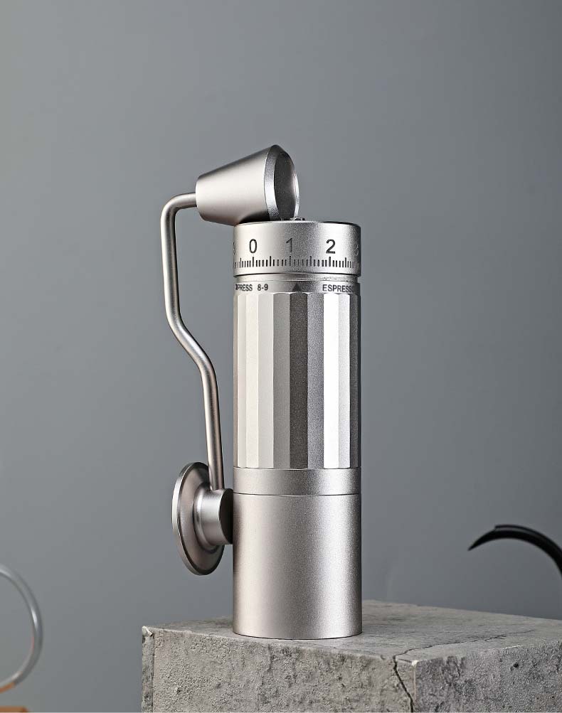 The compact and sleek Artisan Grind R35 silver coffee grinder